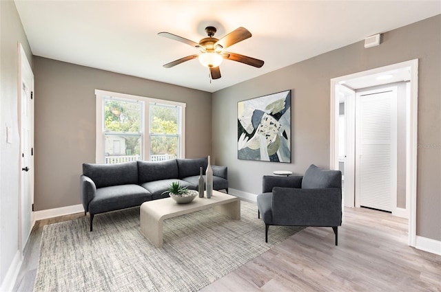 2017 Oceanview Pl, Tampa, FL 33605 - living room featuring baseboards, a ceiling fan, and light wood finished floors