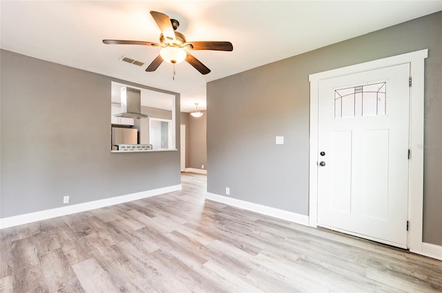 2017 Oceanview Pl, Tampa, FL 33605 - spare room featuring visible vents, a ceiling fan, baseboards, and wood finished floors