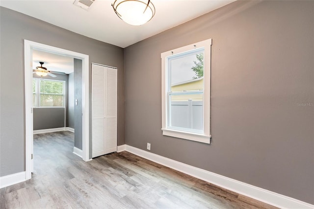 2017 Oceanview Pl, Tampa, FL 33605 - spare room with visible vents, a ceiling fan, baseboards, and wood finished floors
