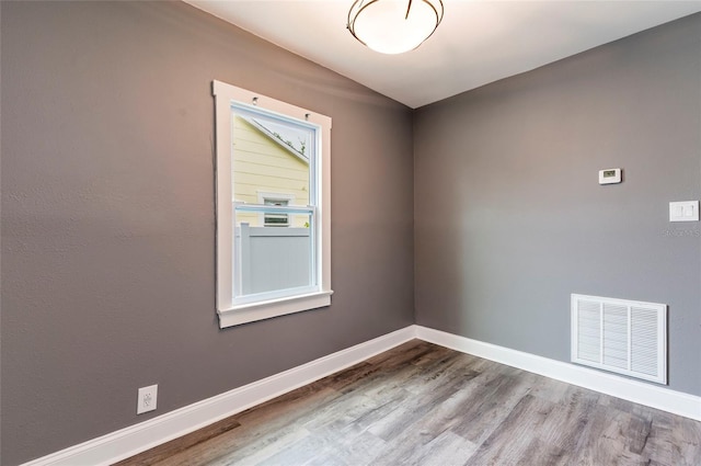 2017 Oceanview Pl, Tampa, FL 33605 - unfurnished room with visible vents, baseboards, and wood finished floors