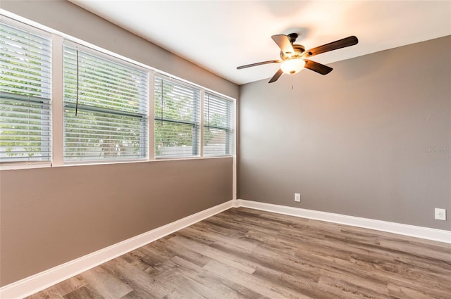 2017 Oceanview Pl, Tampa, FL 33605 - unfurnished room featuring a ceiling fan, baseboards, and wood finished floors