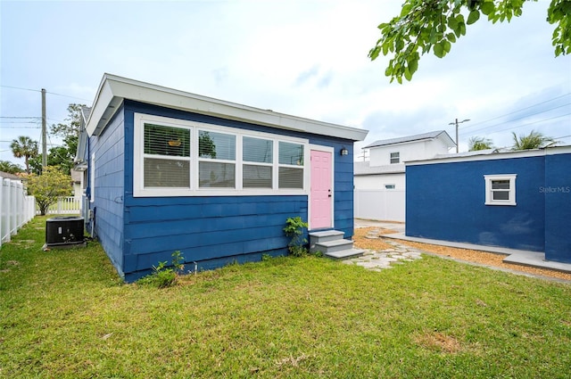 2017 Oceanview Pl, Tampa, FL 33605 - view of front of house featuring entry steps, fence, central air condition unit, and a front yard