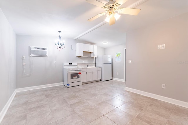 2017 Oceanview Pl, Tampa, FL 33605 - kitchen with white cabinets, white appliances, light countertops, lofted ceiling, and a wall mounted AC