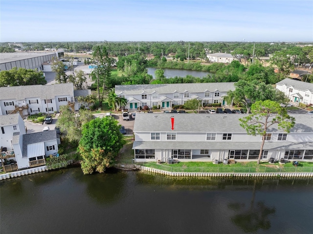 aerial perspective of suburban area with a large body of water