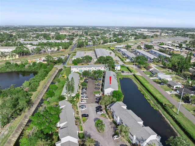 aerial view of property and surrounding area with a large body of water