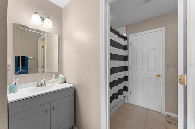 full bathroom with vanity, tile patterned flooring, and a shower with curtain