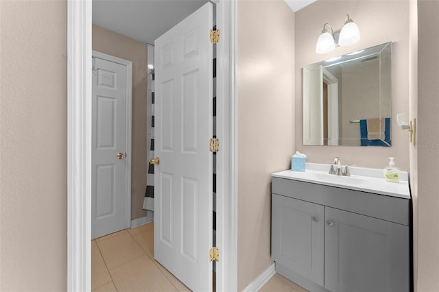 bathroom with vanity and tile patterned flooring