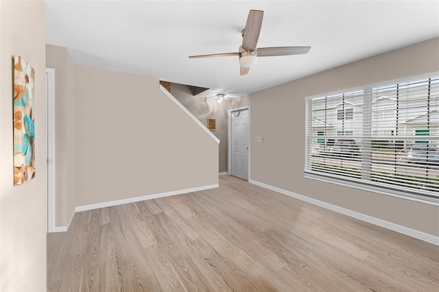 5503 67th Ave N Unit 18, Pinellas Park, FL 33781 - unfurnished living room with light wood-style floors, ceiling fan, and baseboards