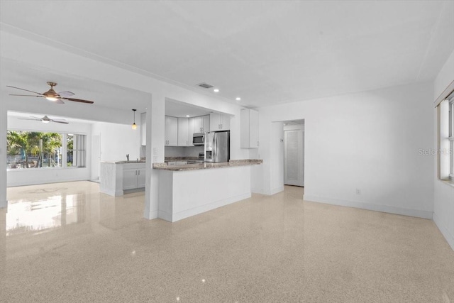 2540 S Shore Dr SE, Saint Petersburg, FL 33705 - kitchen featuring appliances with stainless steel finishes, open floor plan, visible vents, and baseboards