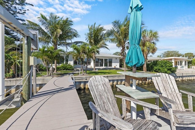 2540 S Shore Dr SE, Saint Petersburg, FL 33705 - wooden deck featuring a dock and a water view