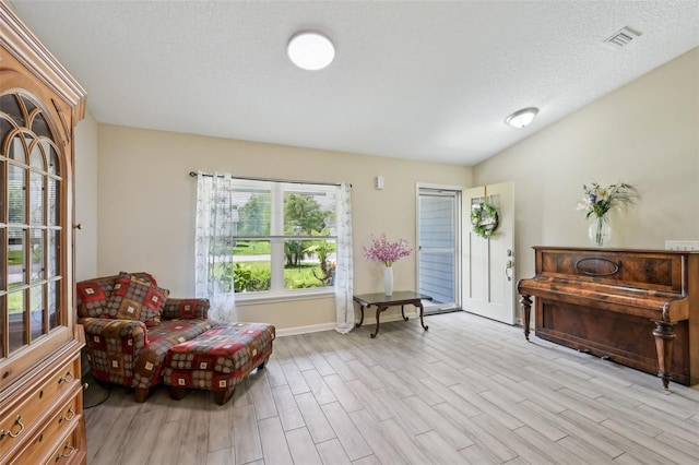 2720 N Screech Owl Ave, Saint Augustine, FL 32084 - living area with wood finished floors, a textured ceiling, and baseboards