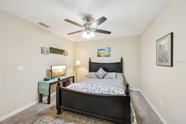 2720 N Screech Owl Ave, Saint Augustine, FL 32084 - bedroom featuring carpet floors, baseboards, a ceiling fan, and a textured ceiling