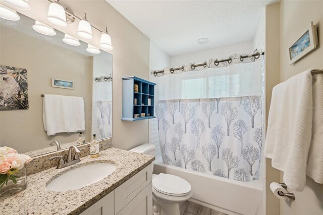 2720 N Screech Owl Ave, Saint Augustine, FL 32084 - full bathroom with shower / bath combo, vanity, toilet, and wood finished floors