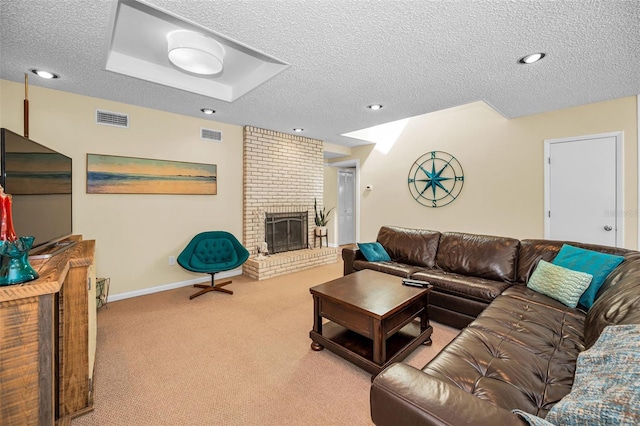 508 N Mayo St, Crystal Beach, FL 34681 - living room featuring a textured ceiling, visible vents, carpet, and a fireplace