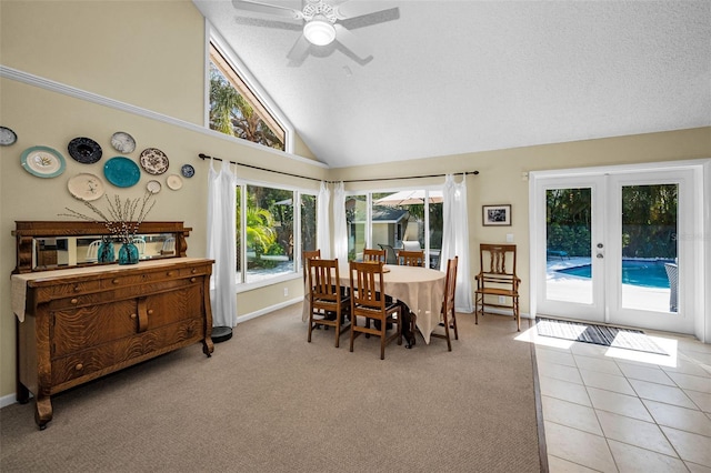 508 N Mayo St, Crystal Beach, FL 34681 - dining room with light carpet, high vaulted ceiling, french doors, a ceiling fan, and baseboards