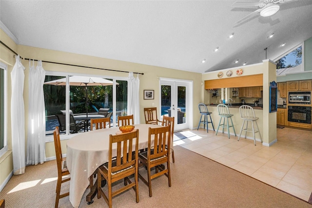 508 N Mayo St, Crystal Beach, FL 34681 - dining room with a ceiling fan, french doors, a textured ceiling, light tile patterned floors, and lofted ceiling