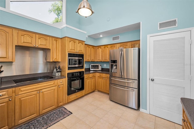 508 N Mayo St, Crystal Beach, FL 34681 - kitchen with a toaster, dark countertops, black appliances, and visible vents