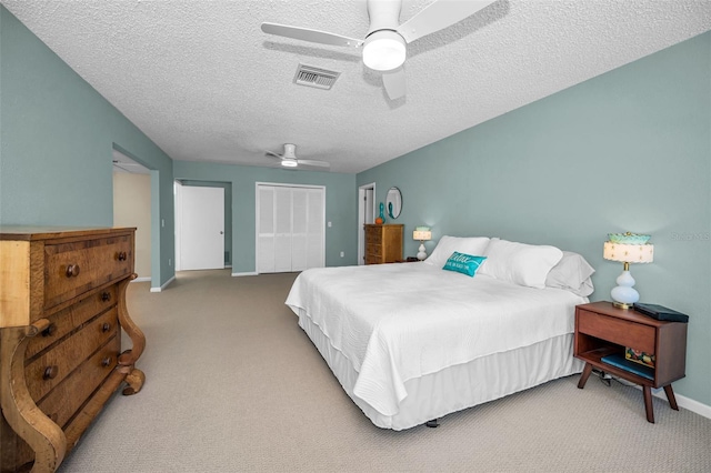508 N Mayo St, Crystal Beach, FL 34681 - bedroom with carpet flooring, ceiling fan, a textured ceiling, baseboards, and visible vents