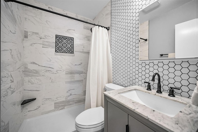 508 N Mayo St, Crystal Beach, FL 34681 - full bath with vanity, tasteful backsplash, a shower stall, and toilet