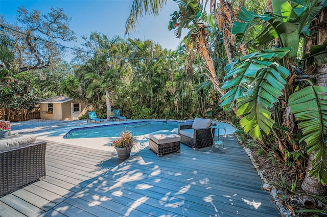 508 N Mayo St, Crystal Beach, FL 34681 - outdoor pool with a storage shed, a deck, and an outdoor structure