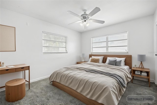 bedroom with baseboards, carpet flooring, a ceiling fan, and multiple windows