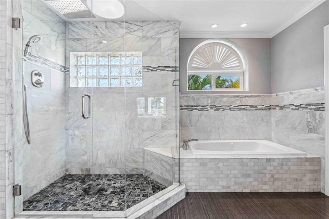 full bath with crown molding, a bath, a wealth of natural light, and a shower stall