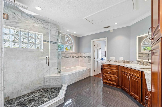 full bathroom featuring vanity, ornamental molding, a garden tub, and a stall shower