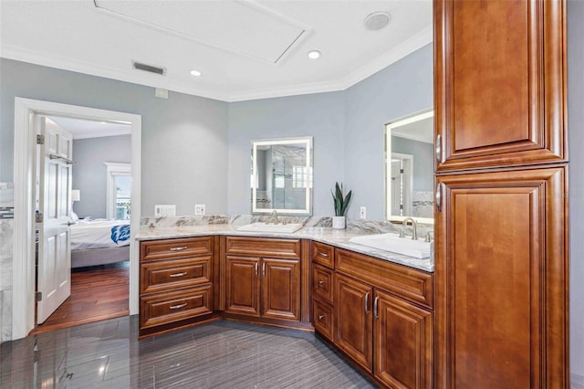full bathroom featuring a sink, ensuite bath, double vanity, and visible vents