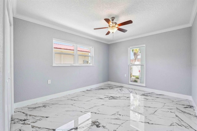 spare room featuring crown molding, a ceiling fan, baseboards, and a healthy amount of sunlight