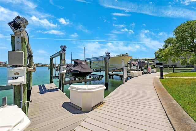 dock area with a water view and boat lift