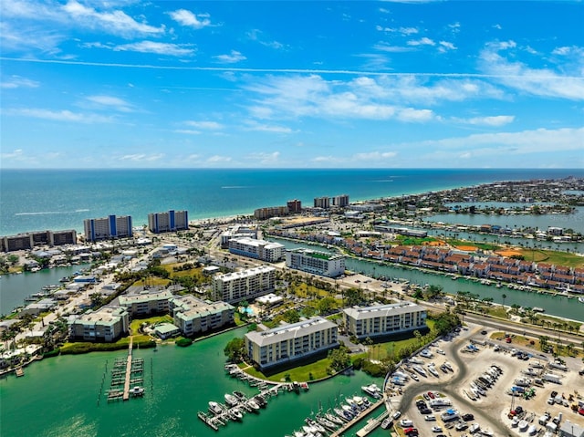 birds eye view of property with a view of city and a water view