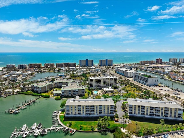 drone / aerial view featuring a view of city and a water view