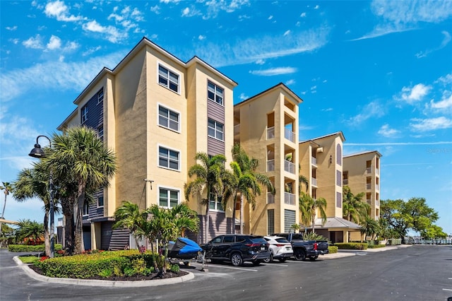 view of property with uncovered parking