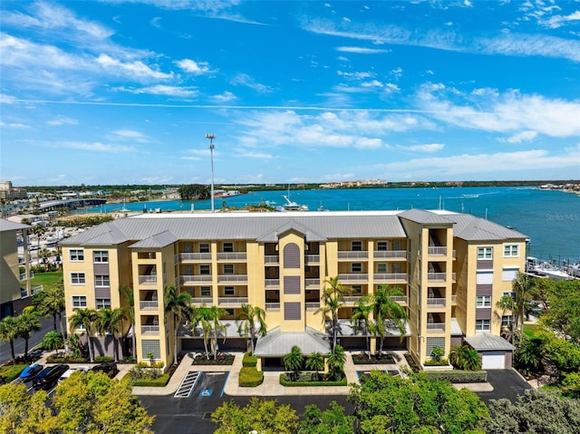 425 150th Ave Unit 2501, Madeira Beach, FL 33708 - view of apartment building / complex featuring a water view