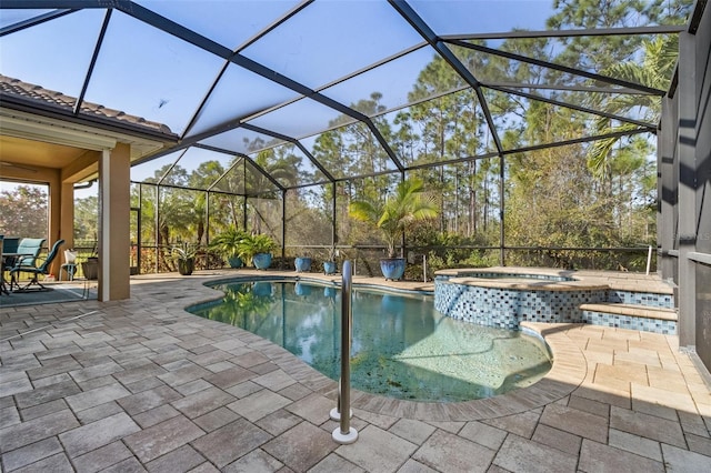 20605 Long Pond Rd, North Fort Myers, FL 33917 - view of swimming pool featuring a patio area, a pool with connected hot tub, and glass enclosure