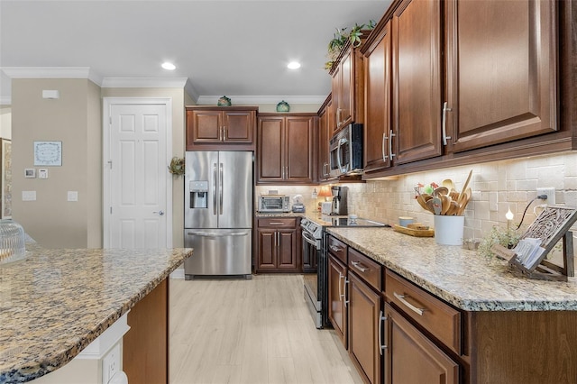 20605 Long Pond Rd, North Fort Myers, FL 33917 - kitchen featuring stainless steel appliances, crown molding, backsplash, light stone countertops, and recessed lighting