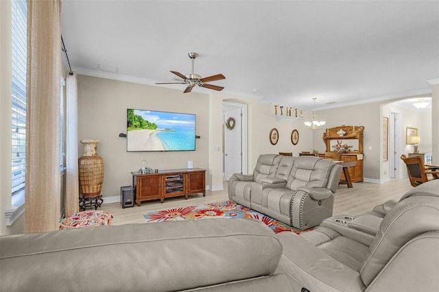 20605 Long Pond Rd, North Fort Myers, FL 33917 - living area with arched walkways, light wood-style floors, crown molding, baseboards, and a ceiling fan