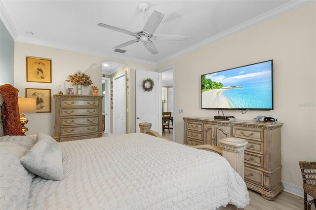 20605 Long Pond Rd, North Fort Myers, FL 33917 - bedroom with crown molding, light wood-type flooring, baseboards, and ceiling fan