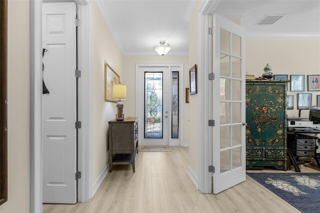 20605 Long Pond Rd, North Fort Myers, FL 33917 - entrance foyer featuring crown molding, wood finished floors, and baseboards