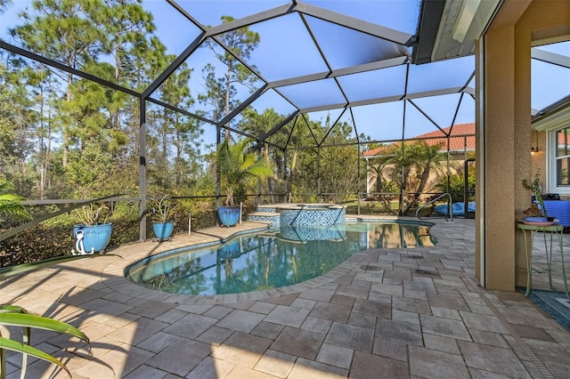 20605 Long Pond Rd, North Fort Myers, FL 33917 - view of swimming pool with a patio area, a pool with connected hot tub, and glass enclosure