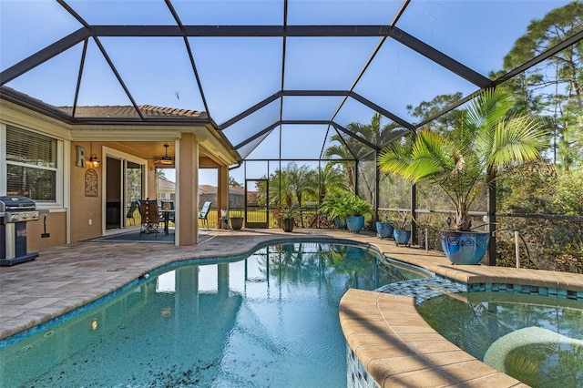 20605 Long Pond Rd, North Fort Myers, FL 33917 - view of swimming pool with a patio, a grill, a pool with connected hot tub, ceiling fan, and a lanai