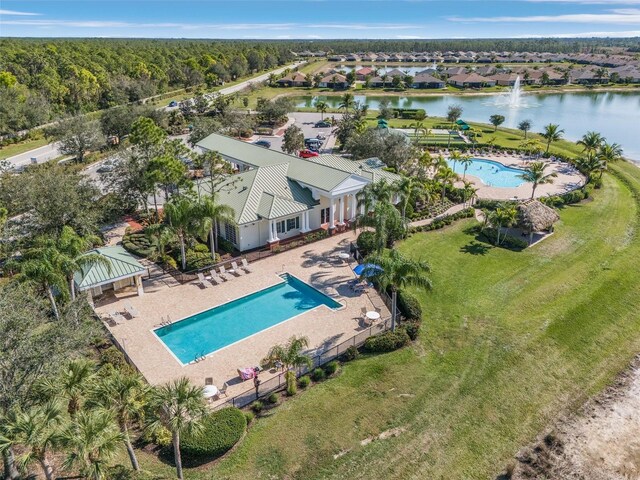 20605 Long Pond Rd, North Fort Myers, FL 33917 - view from above of property with a pool area, a nearby body of water, and a heavily wooded area