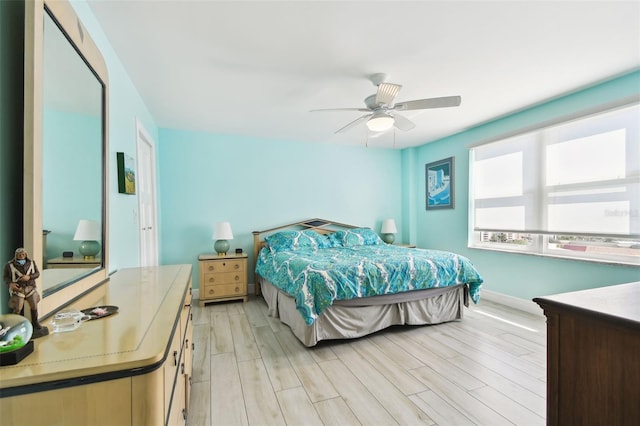 5200 Brittany Dr S Unit 1502, Saint Petersburg, FL 33715 - bedroom featuring baseboards, light wood finished floors, and ceiling fan