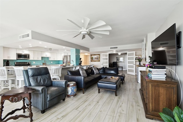 5200 Brittany Dr S Unit 1502, Saint Petersburg, FL 33715 - living area featuring visible vents, light wood-type flooring, a ceiling fan, and recessed lighting