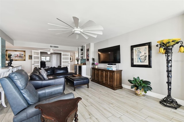 5200 Brittany Dr S Unit 1502, Saint Petersburg, FL 33715 - living room featuring light wood-style flooring, visible vents, ceiling fan, and baseboards