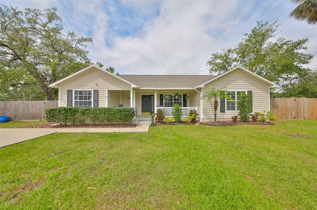 8805 Van Fleet Rd, Riverview, FL 33578 - ranch-style home with a porch, fence, and a front lawn