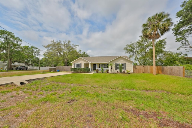 8805 Van Fleet Rd, Riverview, FL 33578 - view of front facade with concrete driveway, fence, and a front lawn
