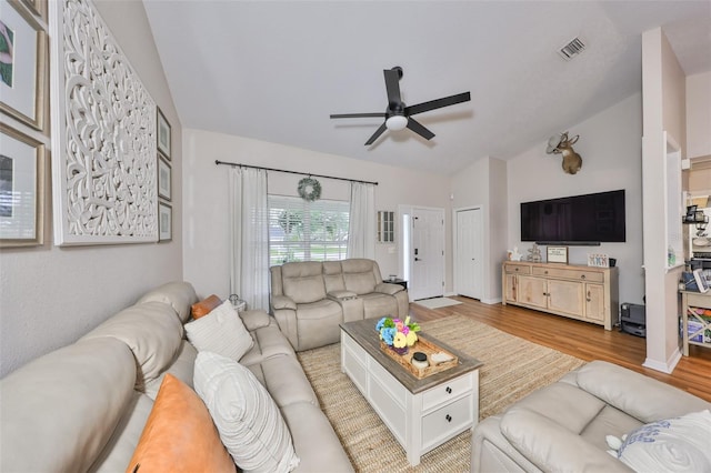 8805 Van Fleet Rd, Riverview, FL 33578 - living area with ceiling fan, vaulted ceiling, visible vents, wood finished floors, and baseboards