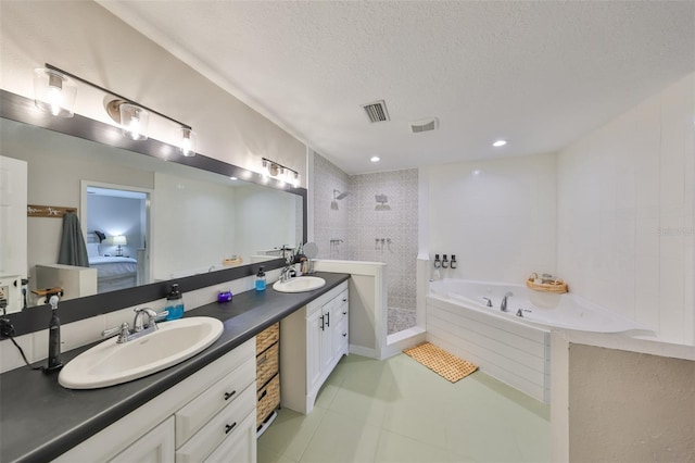 8805 Van Fleet Rd, Riverview, FL 33578 - ensuite bathroom with a sink, visible vents, a bath, and a textured ceiling