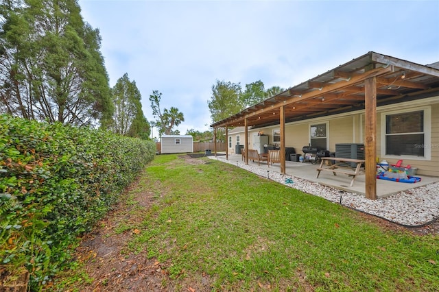 8805 Van Fleet Rd, Riverview, FL 33578 - view of yard featuring cooling unit, an outdoor structure, a patio, a storage unit, and fence